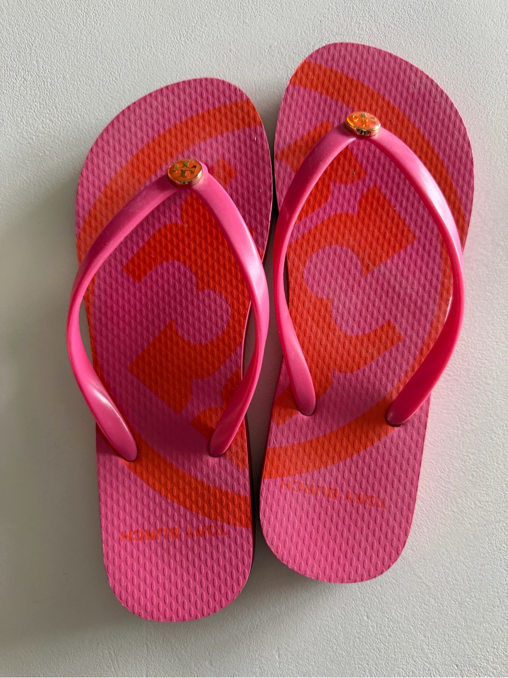 Women’s Tory Burch Hot Pink Flip Flops with Orange Logo. Size 6. In Box.